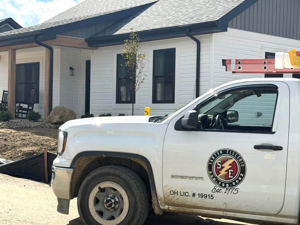 Santon Electric truck outside one of the 12 villas at Shepherd of the Valley in Salem where the company did work.