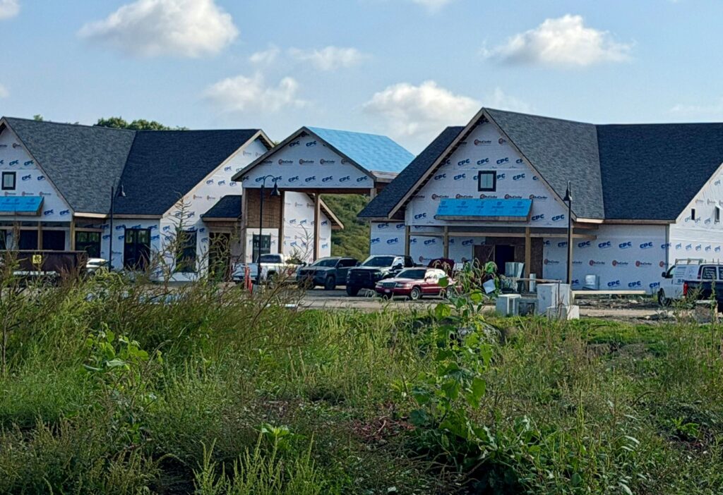 Wide shot of the clubhouse and space where restaurant, theater, fitness center, and more will be located.