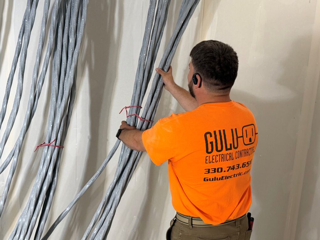 Chris Platton, foreman at Gulu Electric, working with feeder wires for the apartments at Grace Village in Niles.