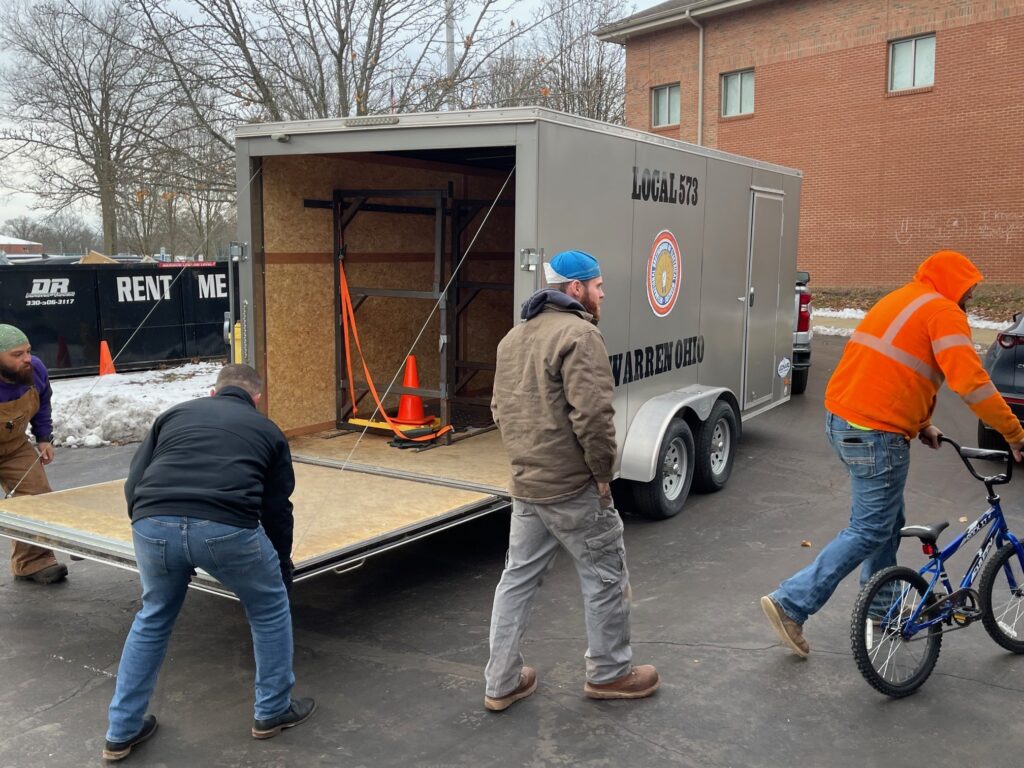 Last bike coming off the Local 573 trailer for the delivery.