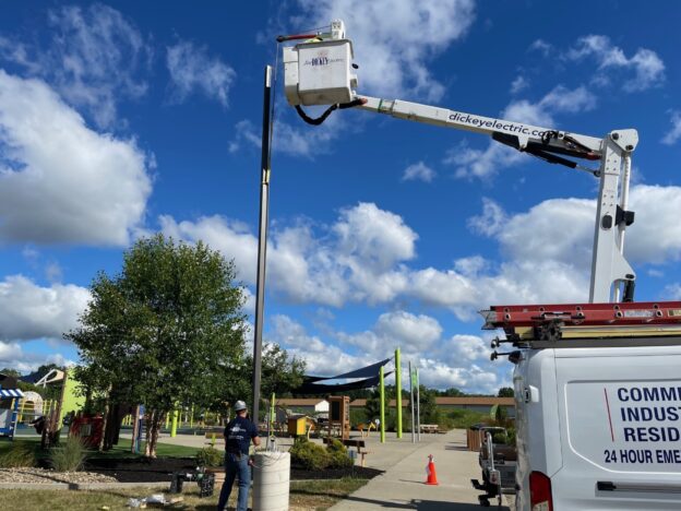 "Joe" Dickey Electric installing light pole at The Walnut Grove in Canfield.