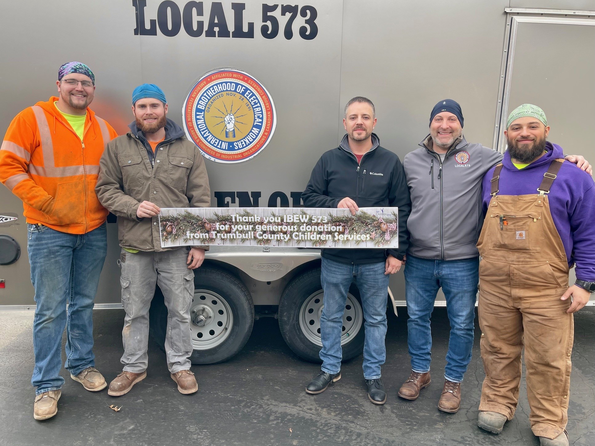 IBEW Local 573 leadership, Todd Ambrose and Mark Phillips, and three apprentices, Luke Culp, Wyatt Baer and Sean Duckworth, for bike donation at Trumbull County Children Services