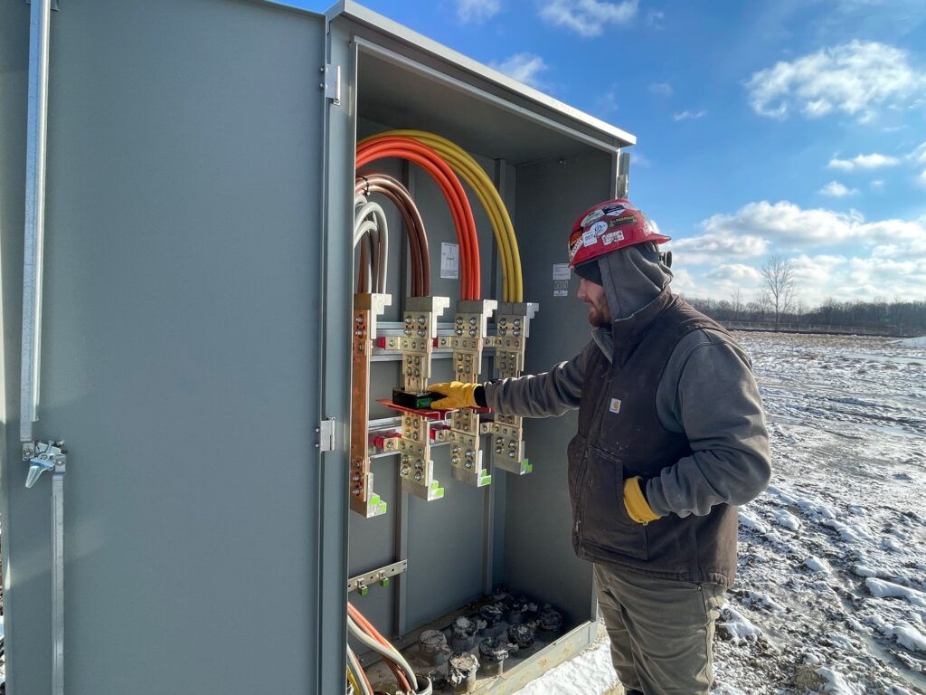 Chris Pearce at the CT cabinet which runs power to the building.