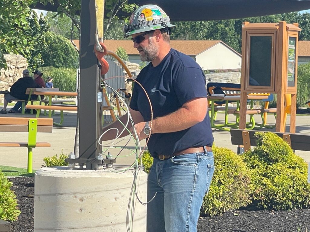 Securing the light pole and wiring for the light pole at The Walnut Grove.