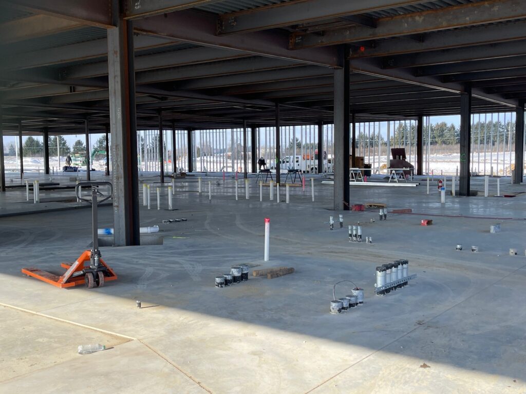 Floor view of the emergency center where electrical stub-ups show. Electrical room and generator to be built in next phase.