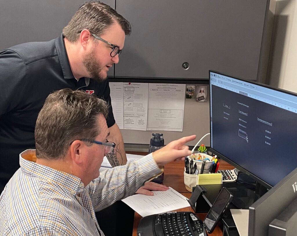 Ed Emerick training Ahren Peplow at the office before he takes over as Youngstown JATC training director.