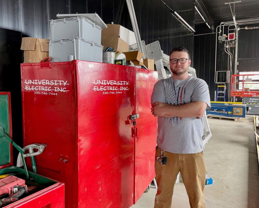 Ahren Peplow at car wash project with University Electric in Boardman in 2023 before becoming Youngstown JATC training director.