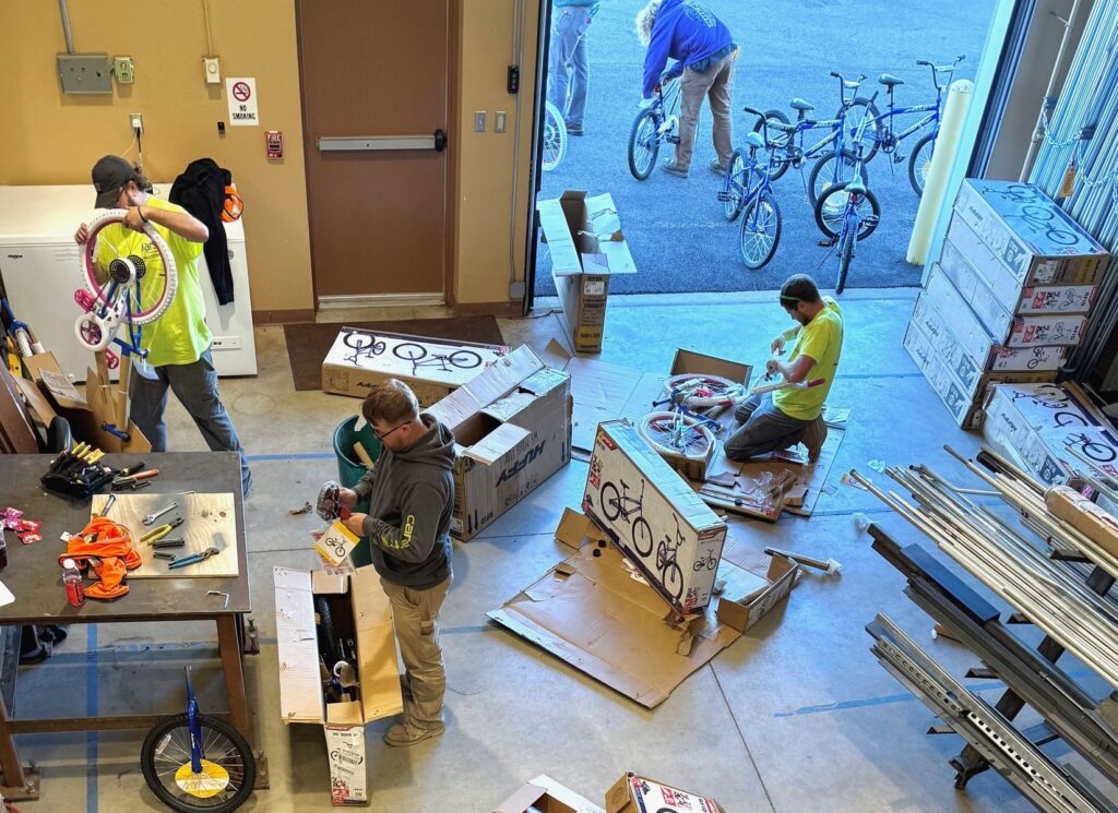 Local 573 members assembling bikes at the union hall in October.