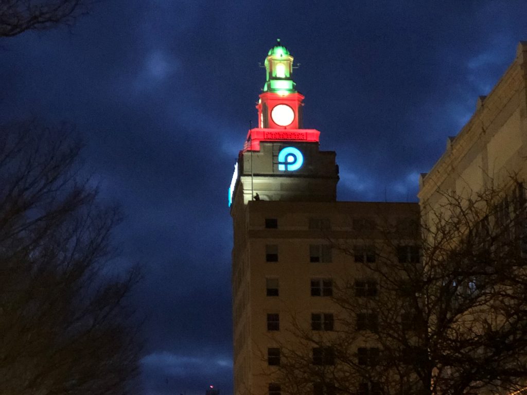 clock tower lit red and green