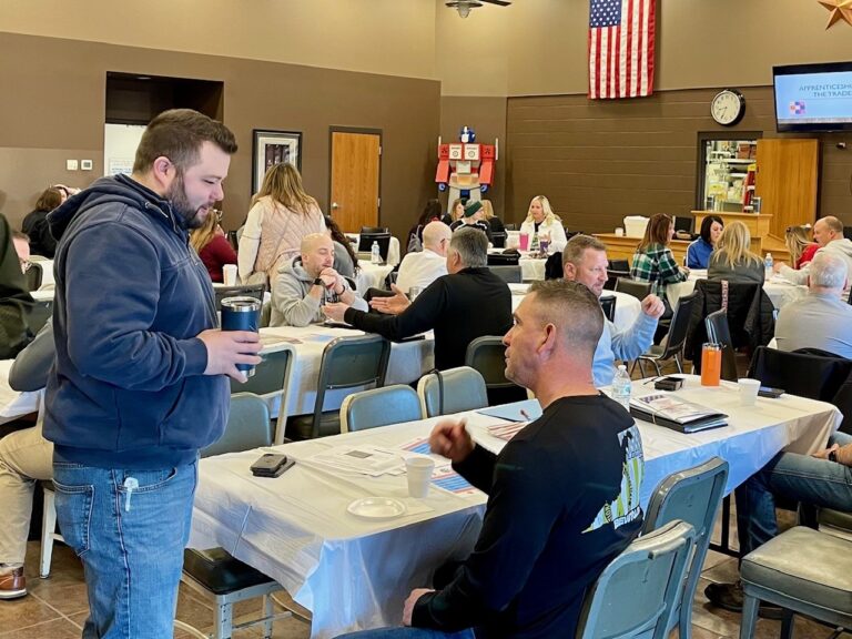 Cody Hilliard and Kenny Lucas, of IBEW Local 64, at guidance counselors presentation about skilled trades.