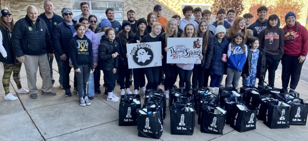 Dan Santon, and the Santon Electric crew, with the Boo Squad volunteers from the 2023 Thanksgiving food drive drop-off. 