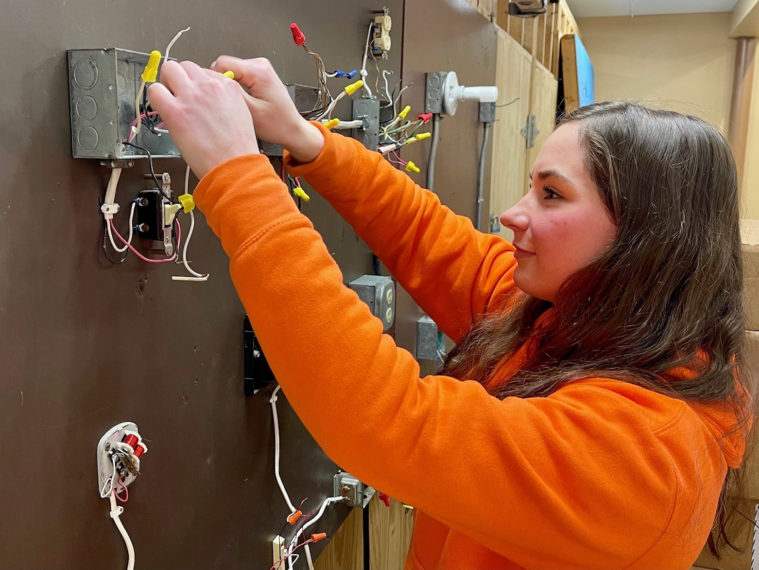 Grace Morrison, IBEW Local 573 apprentice, working on switches at Warren JATC.
