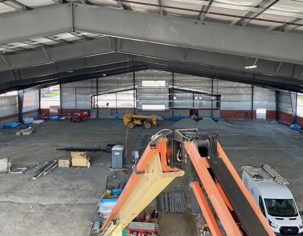 The view from the ceiling where conduit will run power to the indoor training facility.
