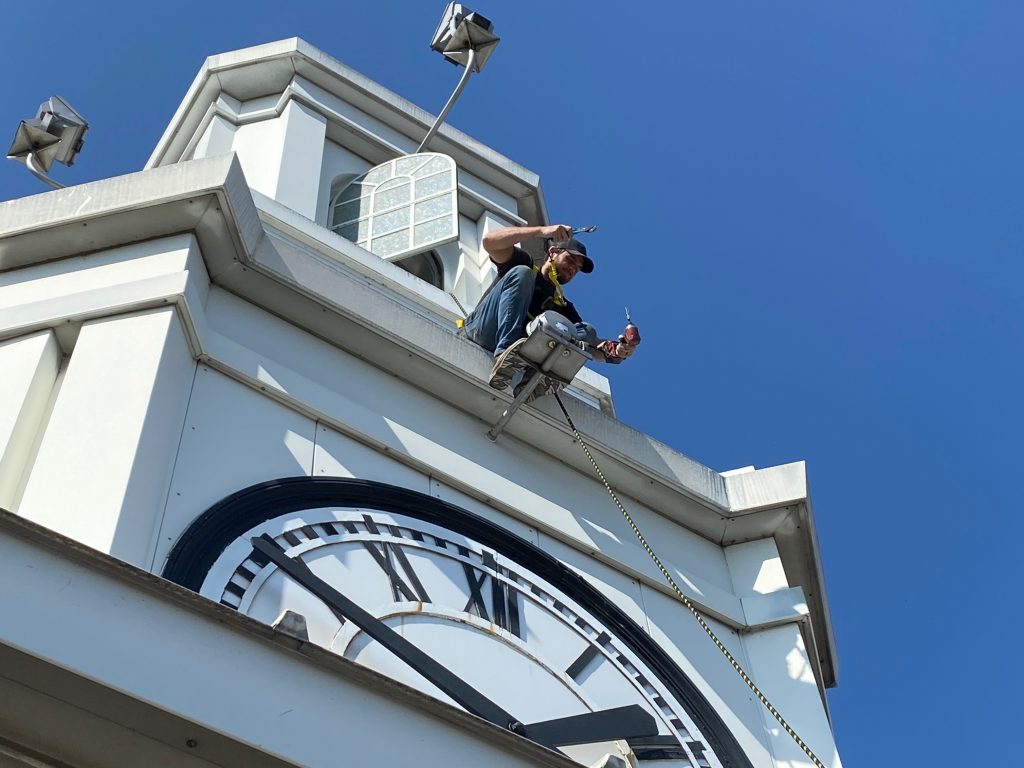 Man outside of clock tower
