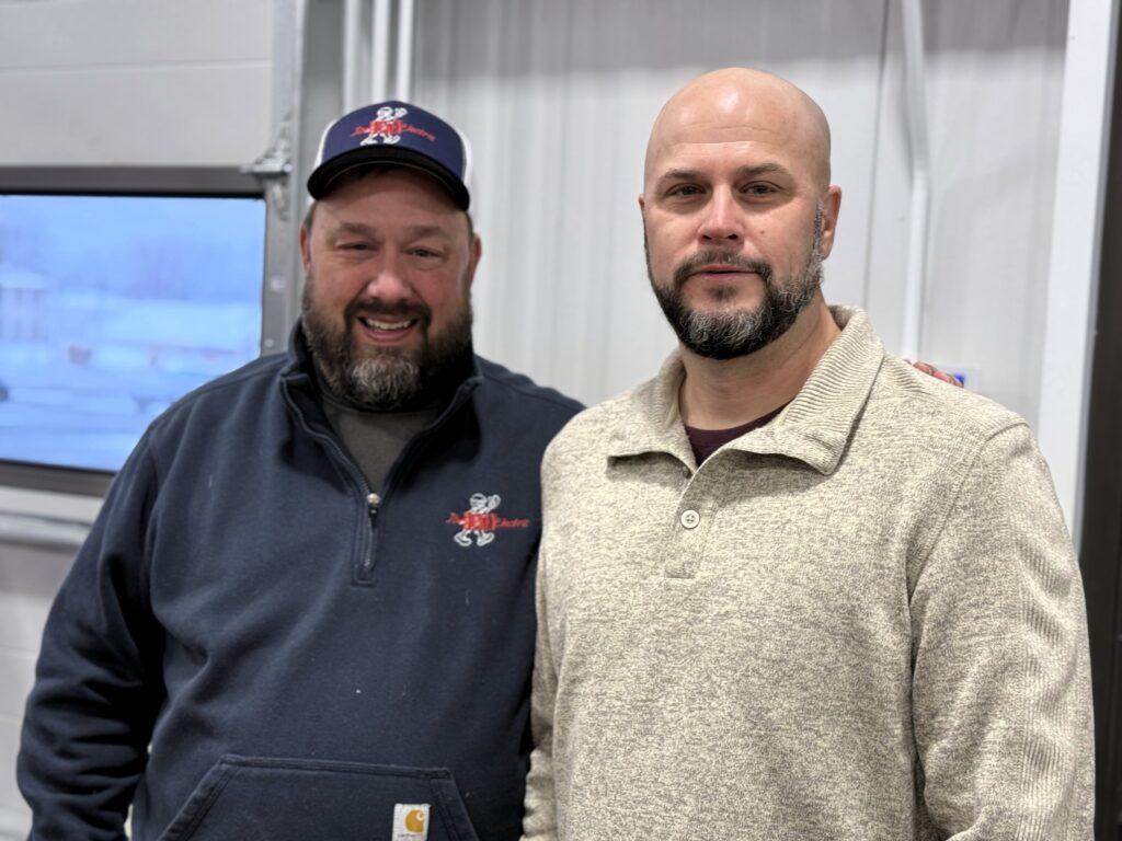 Eric Carlson, president of Dickey Electric, and Brian Crumbacher, project manager, at United Way's Satur-Day of Caring event.