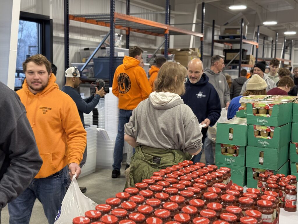 IBEW electricians, NECA Mahoning Valley contractors and volunteers packing groceries at United Way's Volunteer Resource Center during Satur-Day of Caring.