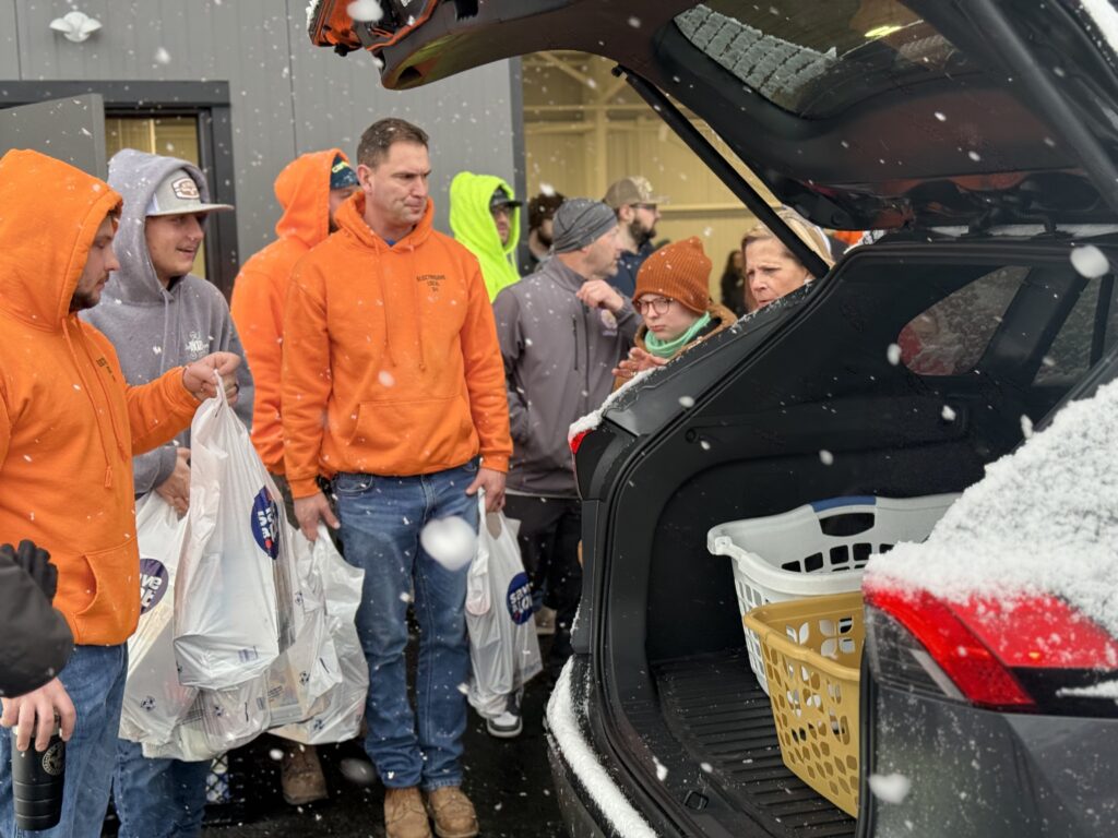 Electricians loading up a car for United Way's Satur-Day of Caring initiative.