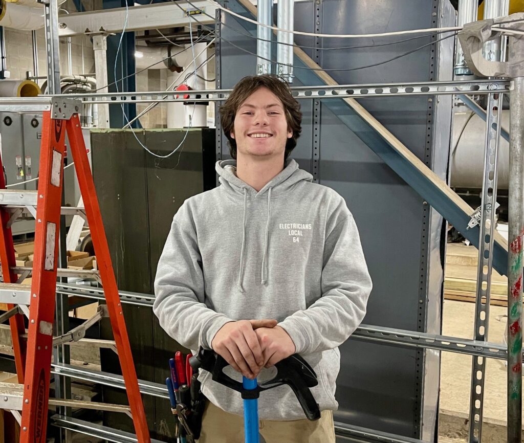 Ivan Lindberg, first-year apprentice with IBEW Local 64, works with University Electric at Mercy Health in downtown Youngstown on the chiller plant.