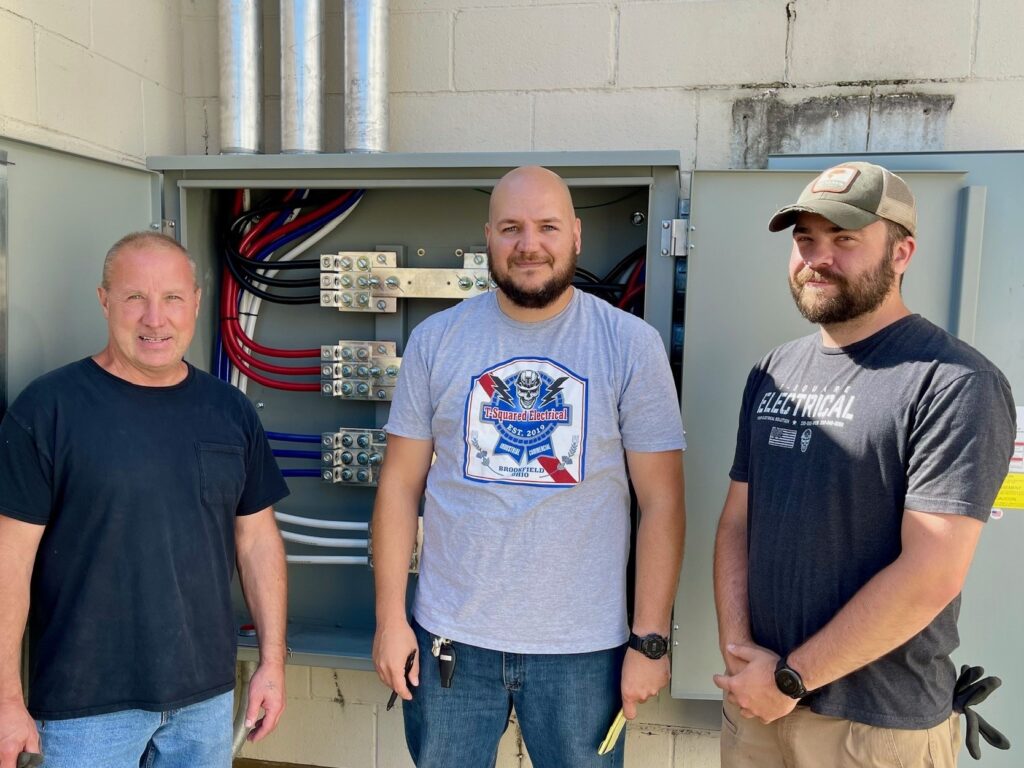 (Left to right) Jerry Kagy, Jeff Mendenhal, and Marcus Durig, of TSquared Electrical at new Caliber Collision in Struthers.