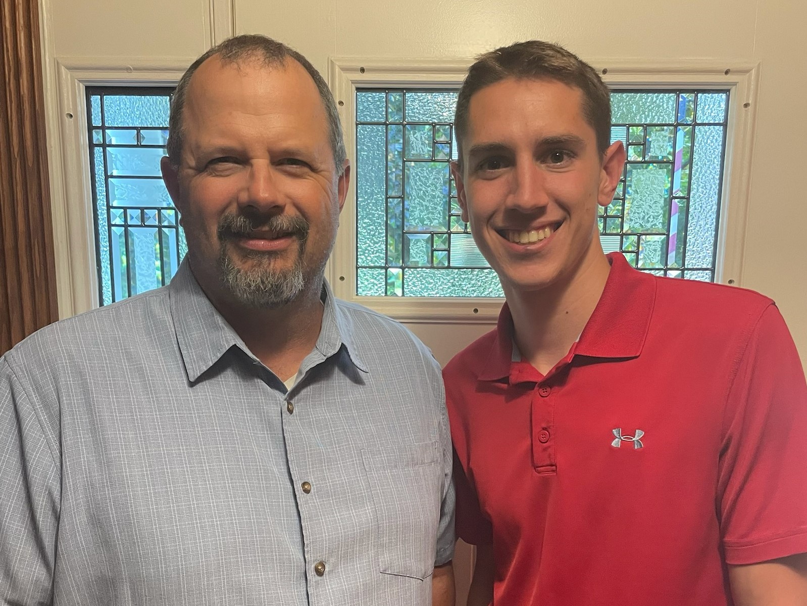 LMCC scholarship winner standing with stepfather