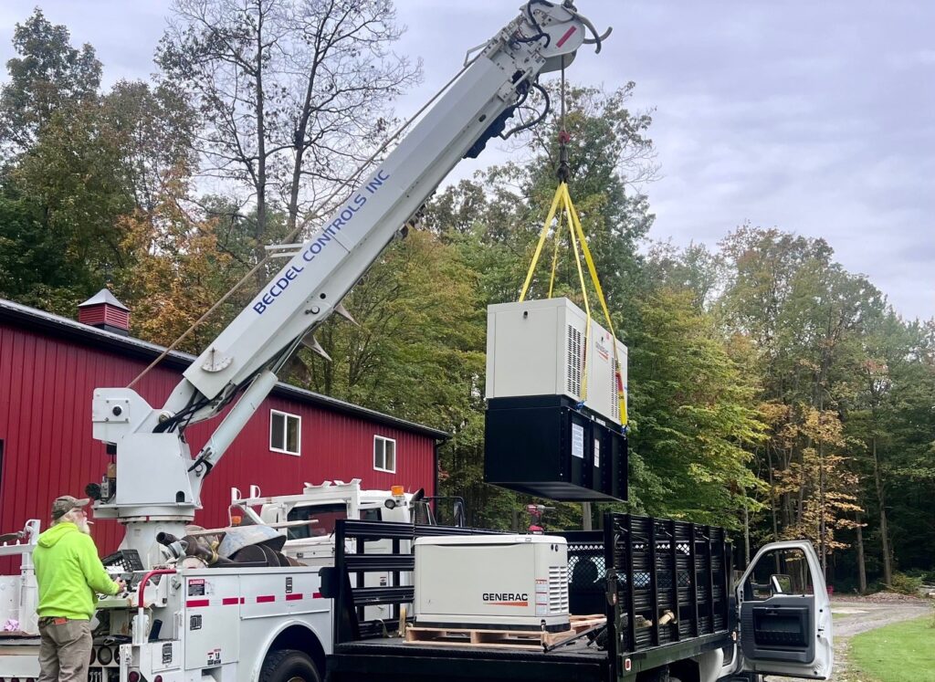 Large generator with diesel tank being installed on a property in Mecca Township.