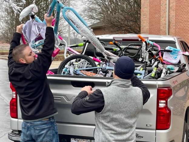 Todd Ambrose, IBEW Local 573 business manager, Mark Phillips, IBEW Local 573 president/organizer, at Trumbull County Children Services delivering bikes for kids at Christmas.