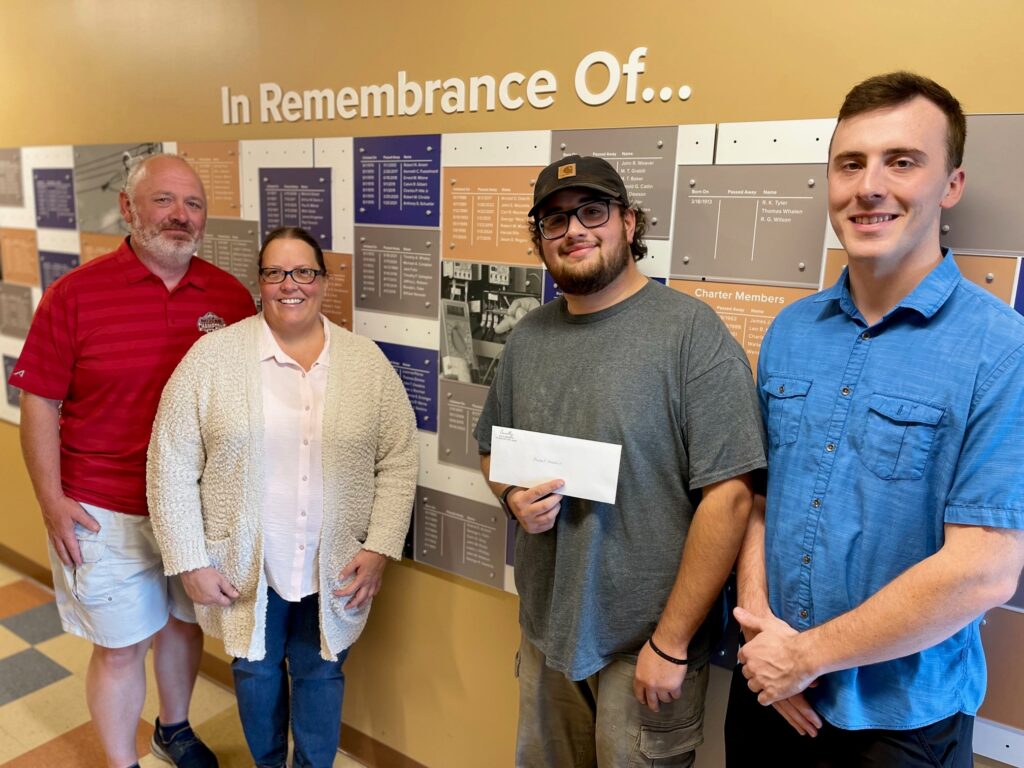 Matt and Amy Connelly (left), Mike Ferradino, memorial scholarship recipient and second-year apprentice, and Jacob Connelly (right).