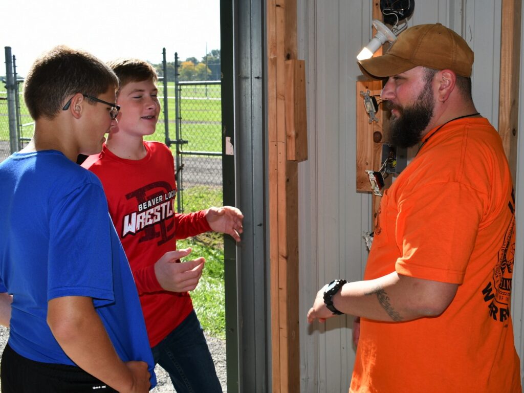Mike Reed shows kids about residential electrical work
