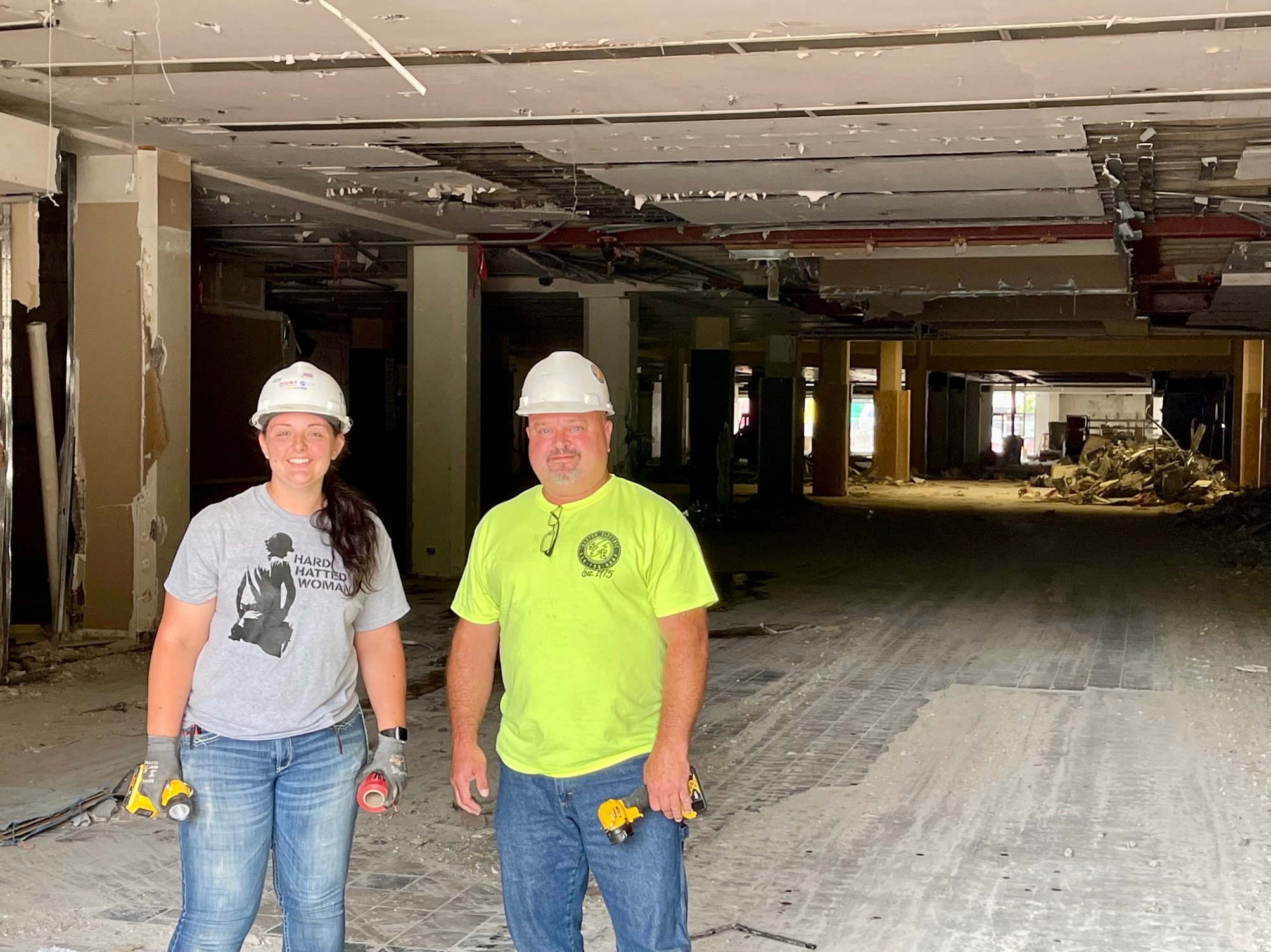 Steve Boyce and Erin Pope, of Santon Electric, stand at Federal Place demolition project in downtown Youngstown