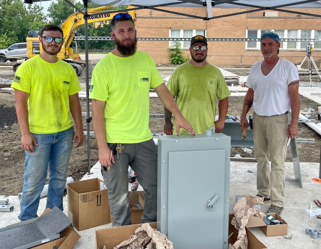 University Electric crew at EV charger parking lot on Fifth Avenue and Martin Luther King Boulevard in Youngstown