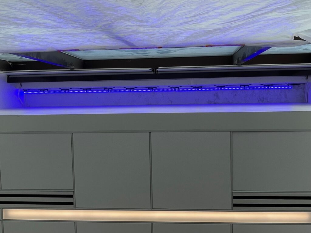 View underneath of Dickey Electric's installation of blue lighting inside Chase Bank in downtown Youngstown.