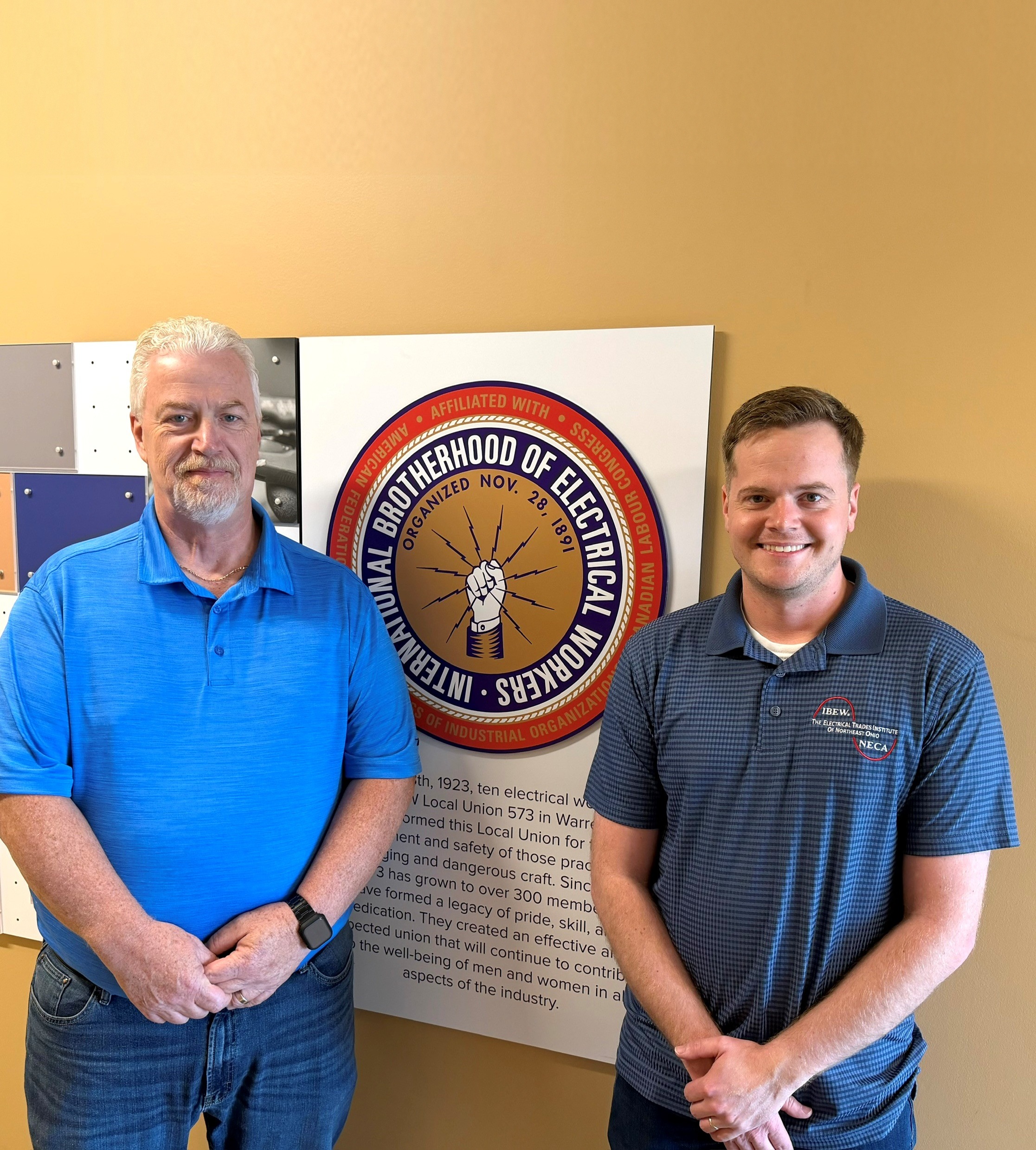 Eric Davis (left) and Luke Gale at Warren Electrical JATC. Davis is retiring after 29 years at the JATC - handing the reins to Gale.