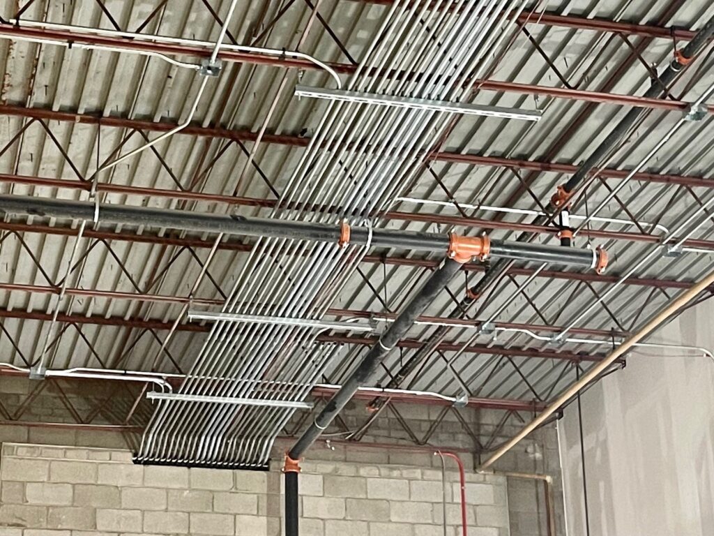 Overhead conduit pipe for lighting the store.